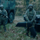 2 soldiers in battle dress and a drone